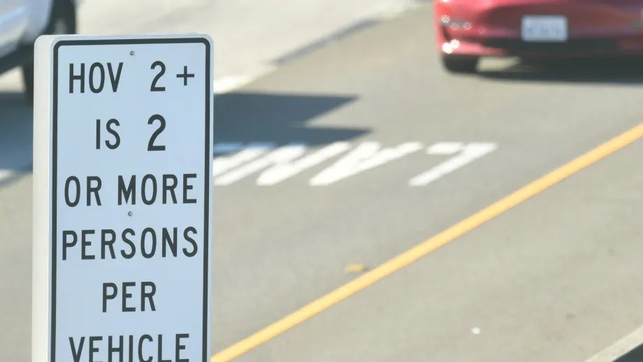 HOV lane sign: HOV is 2 or more persons per vehicle.
