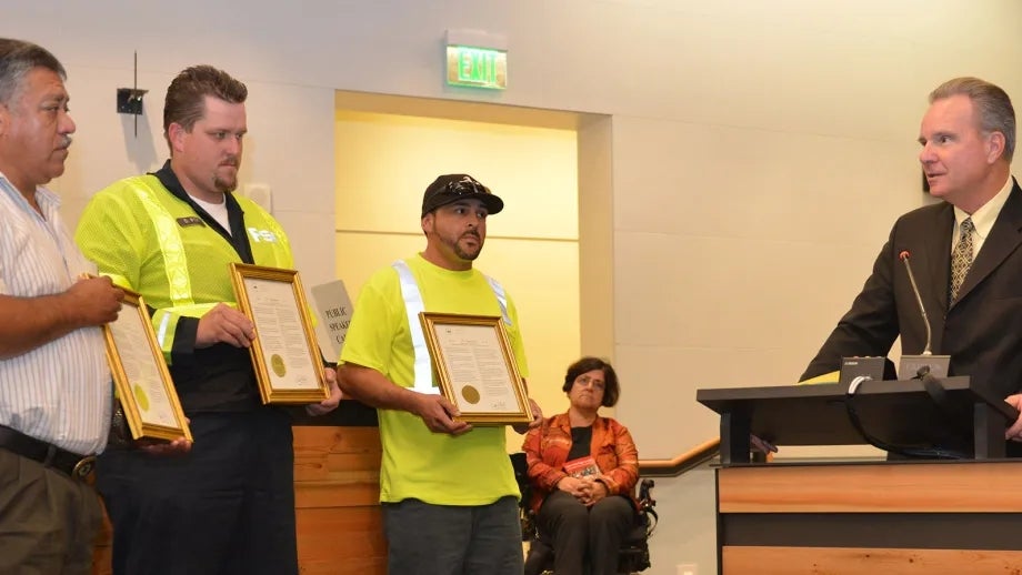 Freeway Service Patrol drivers Moises Reyes (left) and Darryl Poe, and Waste Management of Alameda County driver David Garcia each received a resolution of appreciation from MTC Chair Dave Cortese