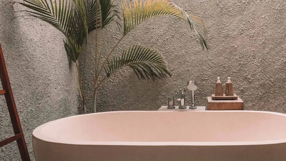 A serene bathtub in a spa-like environment.