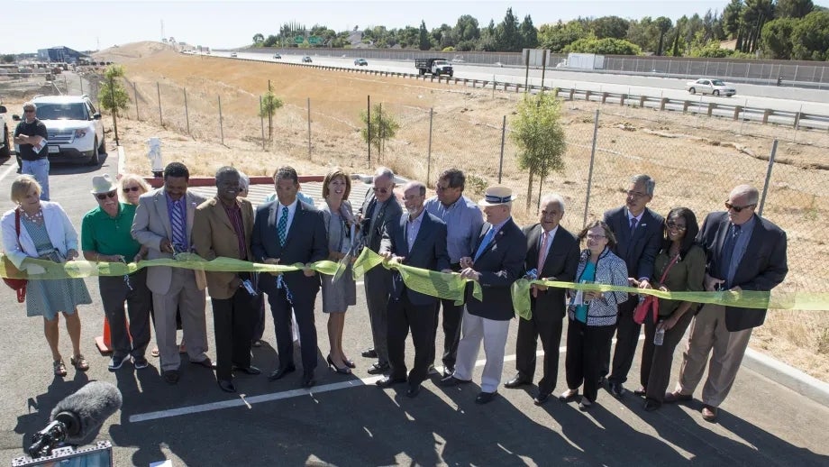 Representatives from partner agencies cut the ribbon to celebrate the Hwy 4 widening project
